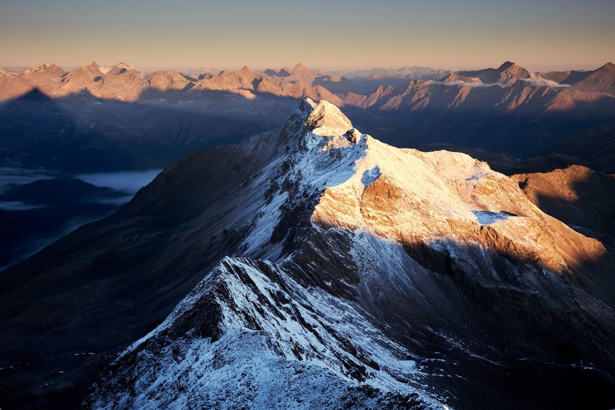 Aerial view of snow covered mountain ranges
