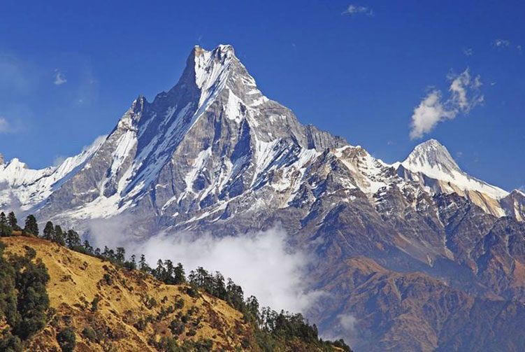 Sharp Himalayan peak above the clouds